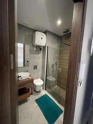 a bathroom with a shower and a toilet and a sink at Cozy studio for rent Casablanca in Casablanca