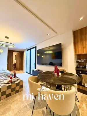 a kitchen and living room with a table and chairs at Happy - 2 BR - Downtown Casablanca in Casablanca