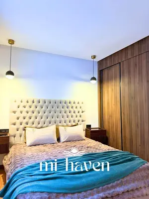 a bedroom with a large bed with the words inhaven at Happy - 2 BR - Downtown Casablanca in Casablanca