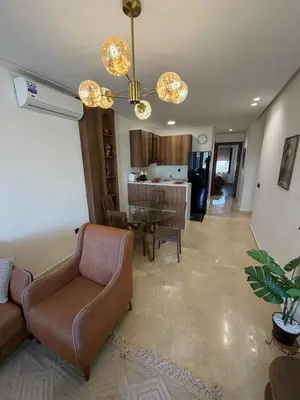 a living room with a couch and a table at Cozy studio for rent for respectful family couple in Casablanca