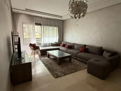 a living room with a couch and a table at Urban Square in Casablanca