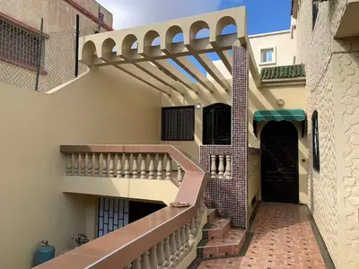 a stairway in a building with a balcony at Grand Andalusian Villa Private Garage and Garden in Casablanca
