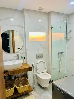a bathroom with a toilet and a sink and a shower at Located at Building 55, Golden Pavilion, 3rd Floor in Casablanca