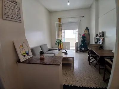 a living room with a couch and a table at Cozy Studio with Balcony, Casa Center Close to Everything in Casablanca