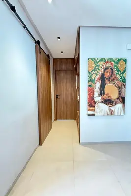 a room with a painting on the wall at Appartement moderne et chaleureux au cœur de Rabat in Rabat