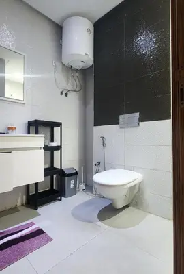 a bathroom with a toilet and a sink at Appartement modern tramway in Casablanca