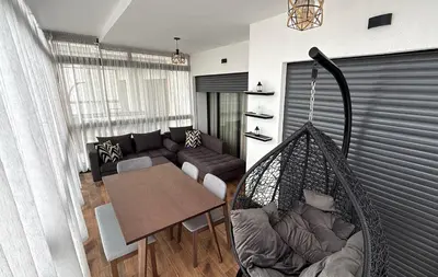a living room with a couch and a hammock at Appartement Résidence Tamaris Park in Tamaris