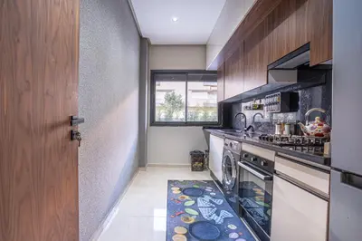a kitchen with a stove and a dishwasher at Luxury Residence Beach Gym and Garage in Pont Blondin
