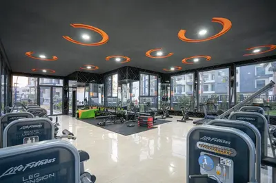 a gym with a lot of exercise equipment in a building at Luxury Residence Beach Gym and Garage in Pont Blondin