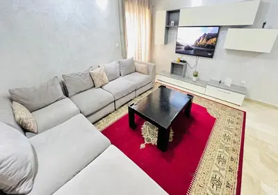 a living room with a couch and a coffee table at Familly Residence in Casablanca