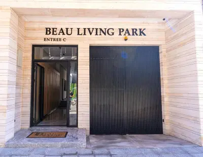 a entrance to a building with a black door at Appartement moderne avec parking, toit terrasse et salle de sport - Anfa Park in Casablanca