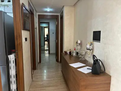 a hotel room with a reception desk and a hallway at Jolie appartement avec piscine privée in Casablanca