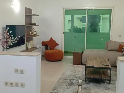 a living room with a couch and a table at Oceania in Mohammedia