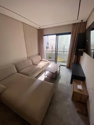 a living room with a couch and a large window at CFC centre d'affaires - Salle de sport - Wifi in Casablanca