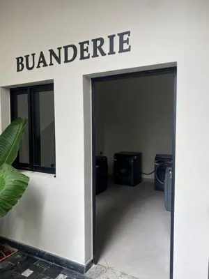 an entrance to a building with a sign that reads bombardier at CFC centre d'affaires - Salle de sport - Wifi in Casablanca