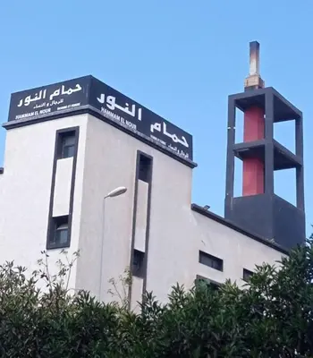 a building with a sign on the top of it at 2 Bedrooms 3 beds and a living room in Dar Bouazza in Dar Ben Abdallah Ben Dehbi