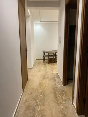 an empty hallway with a table in a room at heaven beach in Sidi Rahal