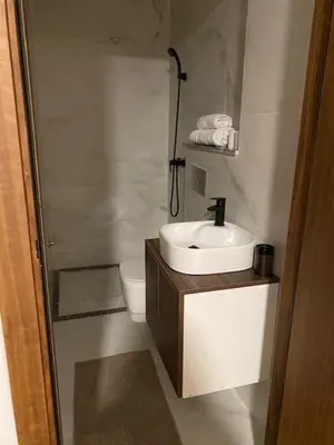 a bathroom with a sink and a toilet at heaven beach in Sidi Rahal