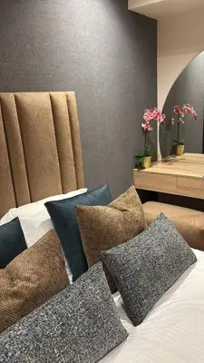a bed with pillows on it in a room at Bridge Collection - Argana in Casablanca