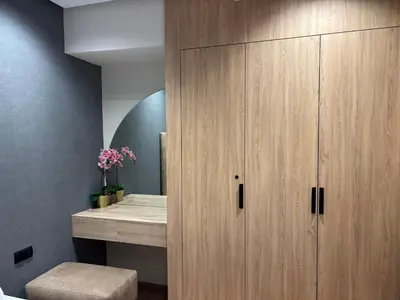 a large wooden cabinet in a bathroom with a bed at Bridge Collection - Argana in Casablanca