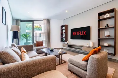 a living room with two couches and a tv at Luxury Apartment Anfaplace Cosy & Design in Casablanca