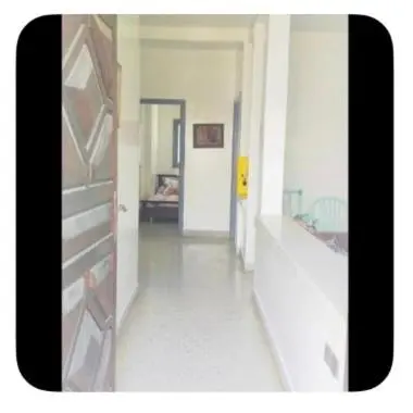 a hallway of a hospital with a room with a bed at Dar Khnata in Temara