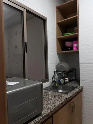 a kitchen counter with a sink and a mirror at Havre de paix in Rabat