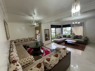 a large living room with couches and a couch at Harhoura Sea view apartment with green spaces and a pool in El Harhoura