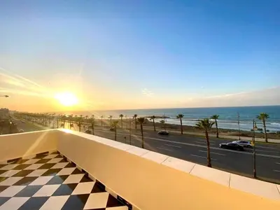 a view of the ocean from the balcony of a building at 2BR Sea View Apartment - Balcony I Parking in Rabat