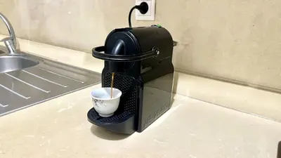 a coffee maker sitting on a counter with a cup at 2BR Sea View Apartment - Balcony I Parking in Rabat