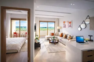 a living room with a couch and a table at Modern Cozy Apartment in Prime Location in Nouaceur