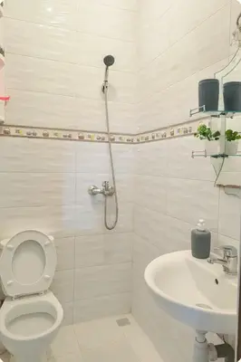 a bathroom with a shower and a toilet and a sink at Cosy appart 1min de casanearshore & Zinit in Casablanca