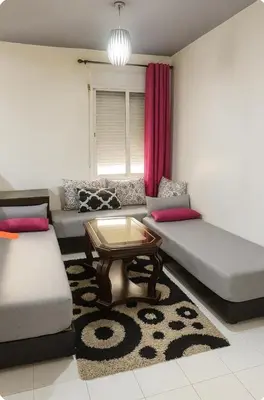 a living room with two couches and a coffee table at Cosy appart 1min de casanearshore & Zinit in Casablanca