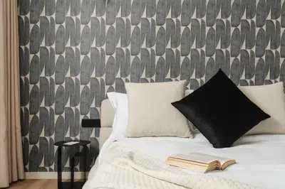 a bedroom with a bed with a book on it at Oasis Residence by GoodMove - Casablanca in Casablanca