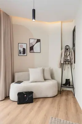 a white bedroom with a bed and a ladder at Oasis Residence by GoodMove - Casablanca in Casablanca