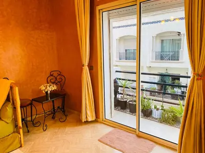 a room with a large window with a balcony at Elegant cultural 2-bedroom apartment in central Casablanca in Casablanca