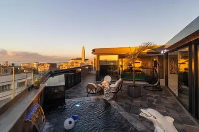 a balcony with a pool on top of a building at Casablanca Luxury Penthouse with Jacuzzi & Views in Casablanca