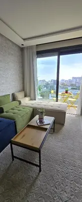 a living room with a couch and a table at New And Bright Terrace Panoramic View in Casablanca