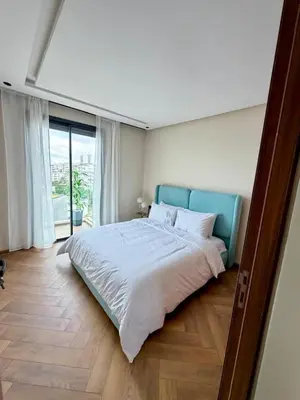 a bedroom with a large bed and a large window at New And Bright Terrace Panoramic View in Casablanca