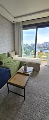 a living room with a couch and a table at New And Bright Terrace Panoramic View in Casablanca