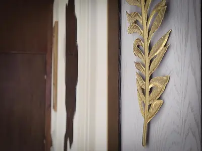 a wall with gold leaf decorations on a wall at Prestige appartement centre Agdal Rabat in Rabat