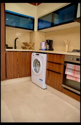 a kitchen with a washing machine in a kitchen at Cosy studio disponible sur maarif princesses in Casablanca