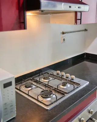 a stove top oven sitting in a kitchen at Joli studio disponible sur maarif boulevard danfa in Casablanca
