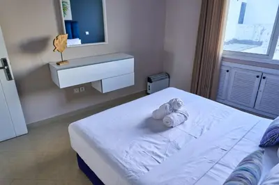a stuffed animal sitting on a bed in a bedroom at Joli studio disponible sur maarif boulevard danfa in Casablanca