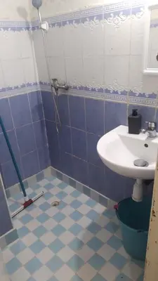 a bathroom with a sink and a shower at Belle chambre sidi maarouf in Casablanca