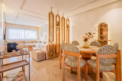 a living room with a table and chairs at LuxArt Casablanca in Casablanca
