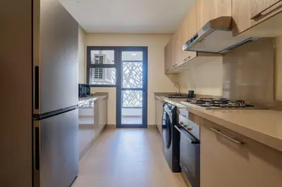 a kitchen with a refrigerator and a stove top oven at LuxArt Casablanca in Casablanca