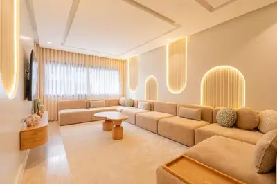 a living room with a couch and a table at LuxArt Casablanca in Casablanca