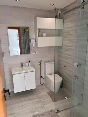 a bathroom with a toilet and a sink and a shower at Casablanca comfort stay in Casablanca