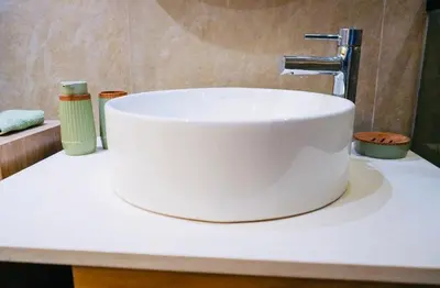 a white sink sitting on a counter in a bathroom at Les princesses studio confortable in Maarif